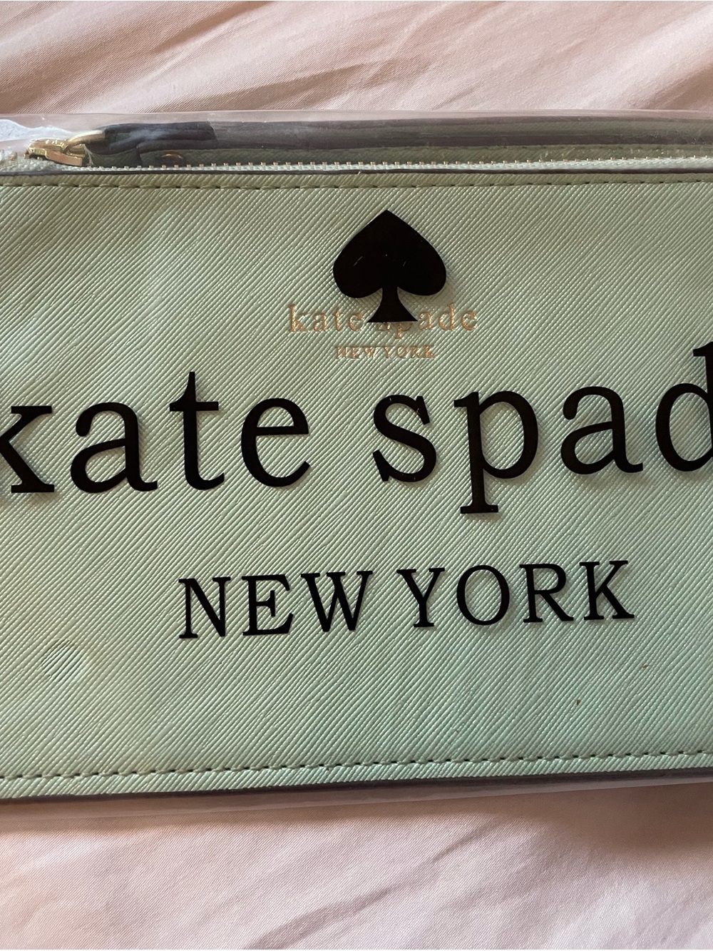 kate spade mint green logo zip pouch with black lettering